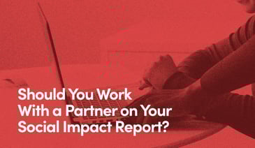 Close up of two people operating laptop with text - Should you work with a partner on yours social impact report