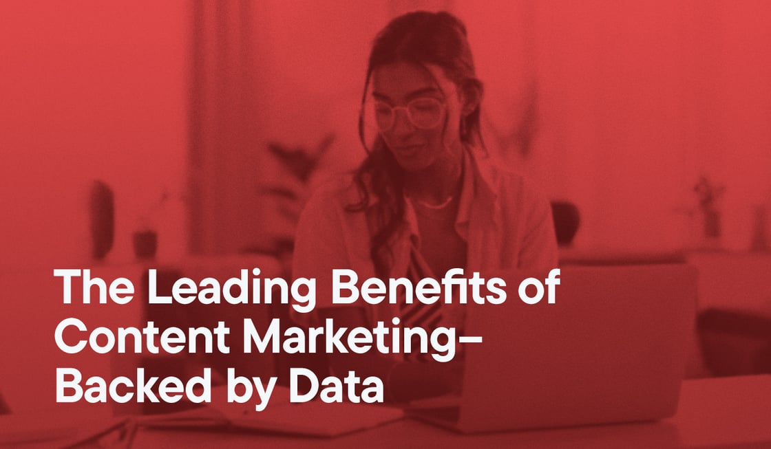 The Leading Benefits of Content Marketing–Backed by Data overlayed on an image of a woman typing on her laptop.