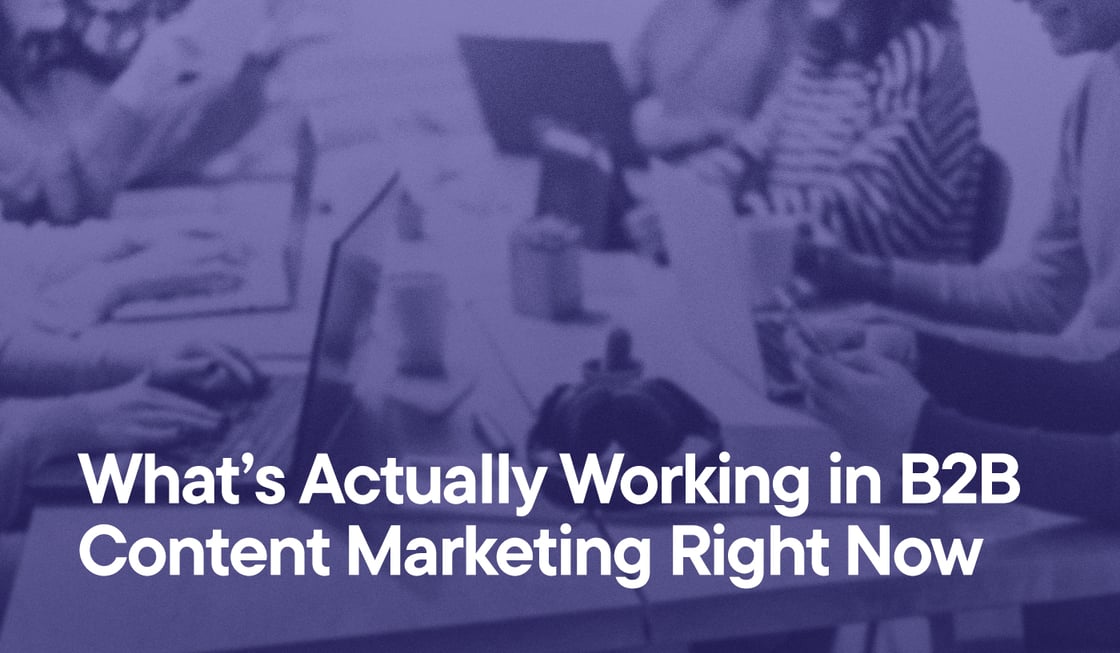 What’s Actually Working in B2B Content Marketing Right Now overlayed on an image of people sitting around a table doing work on their laptops or smart phones