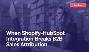 When Shopify-HubSpot Integration Breaks B2B Sales Attribution overlayed on an image of a woman in a small warehouse looking at orders on the computer and making a phone call on her cell phone.