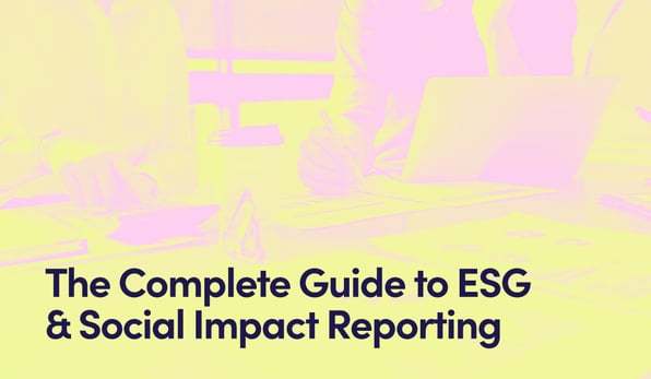 Close up of two people reviewing data on a laptop with text - The Complete Guide to ESG & Social Impact Reporting