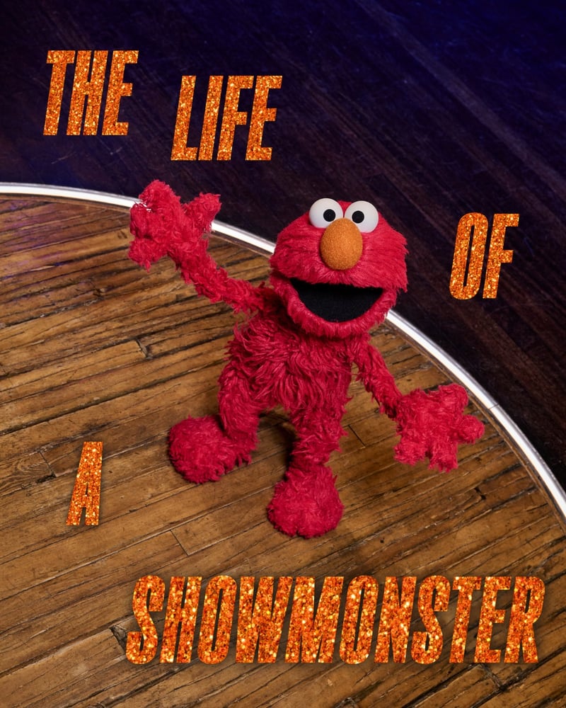 Sesame Street's Elmo on stage doing jazz hands with sparkly orange text, 'The Life of a Showmonster'