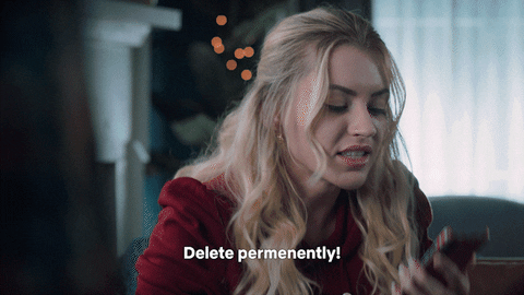 A girl pressing her phone screen saying 'Delete permanently!'