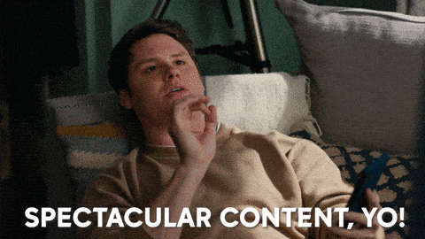 A guy on his phone saying 'Spectacular content, yo'