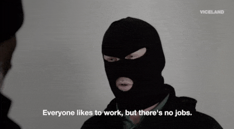 A person in a ski mask saying, 'They keep saying there's jobs. There isn't'.