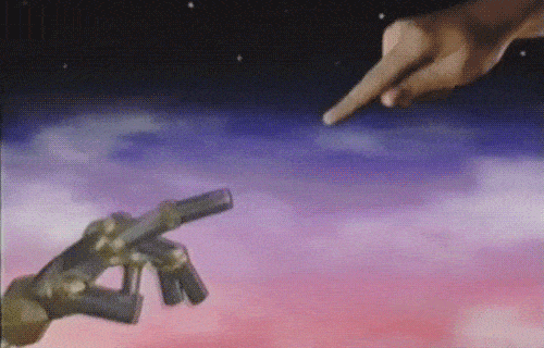 A robot hand and a human hand reaching towards each other