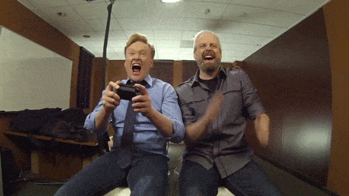 Conan O’Brien excitedly playing a video game