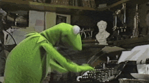 Kermit typing wildly on a typewriter