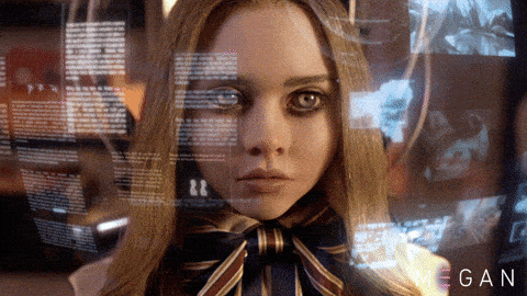 M3GAN the robot looking at images and text from a projection
