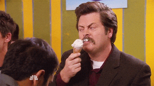 Ron Swanson eating an ice cream cone.
