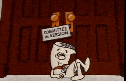 The Bill from Schoolhouse Rock waiting outside a door that says committe in session; it daydreams about becoming a law