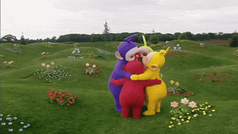 The Teletubbies hugging each other