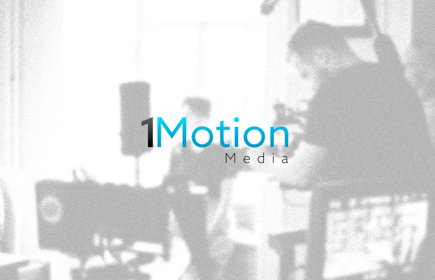 1Motion Media logo overlayed on an image of a film set