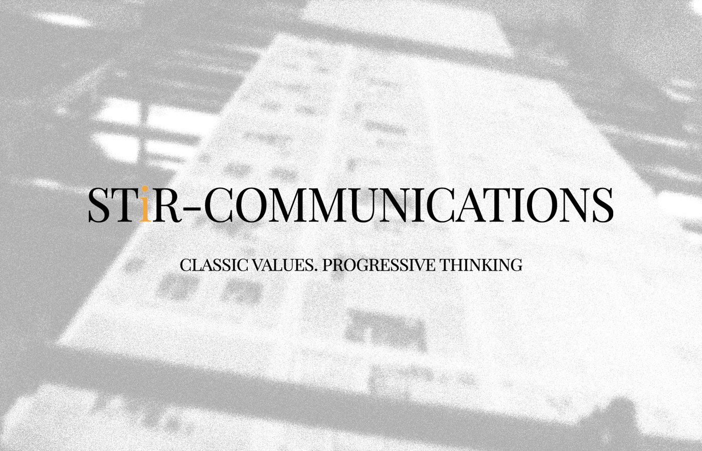 Text that says 'STiR Communications, classic values progressive thinking' overlayed on an image of a building.