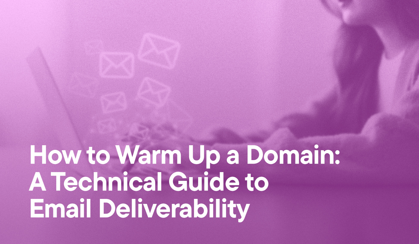 How To Warm up a Domain: A Technical Guide To Email Deliverability overlayed on an image of a woman sending emails from her laptop. Multiple envelope icons are flying out of the screen.
