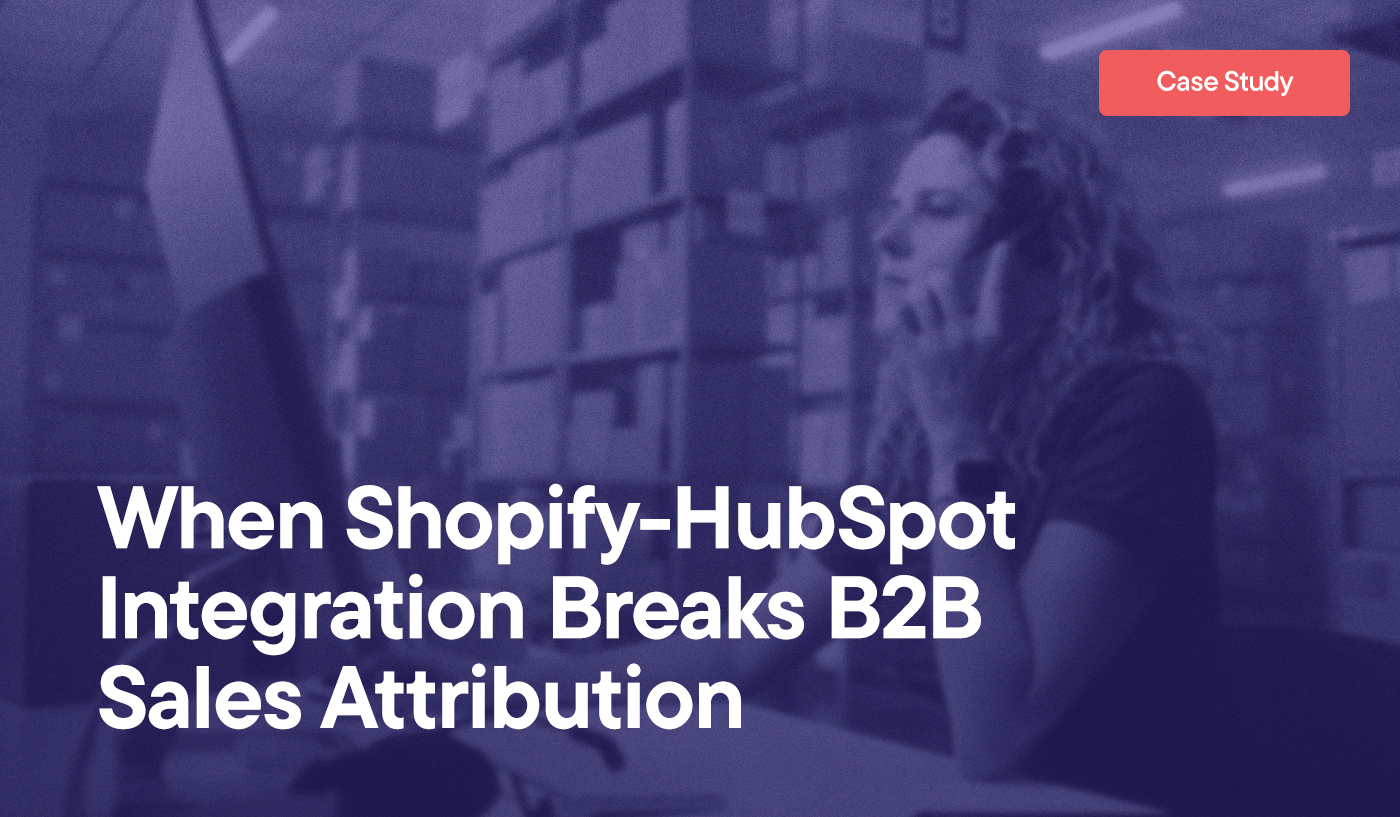 When Shopify-HubSpot Integration Breaks B2B Sales Attribution overlayed on an image of a woman in a small warehouse looking at orders on the computer and making a phone call on her cell phone.